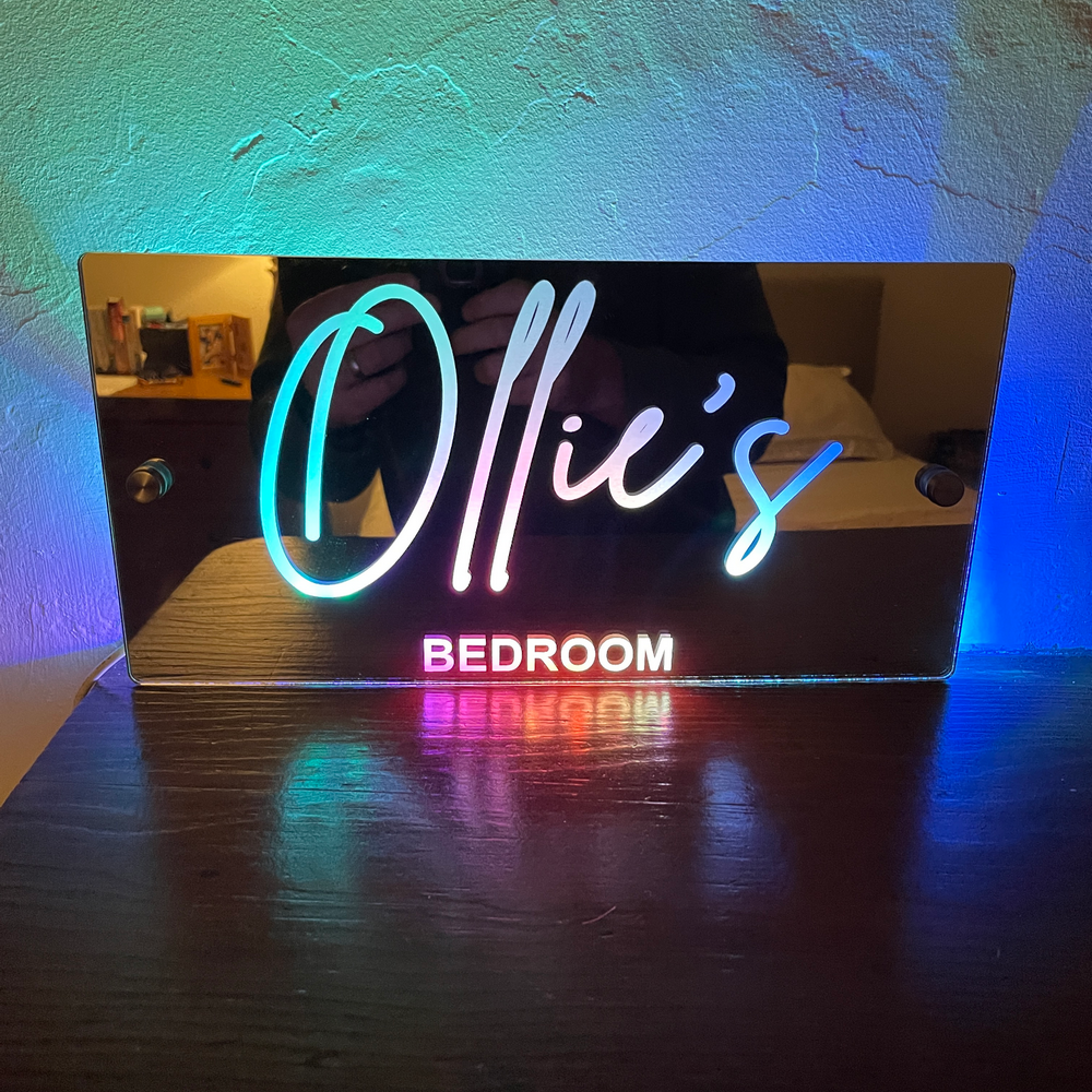 Stylish personalised name mirror with changeable LED lights, perfect for personalised room accents