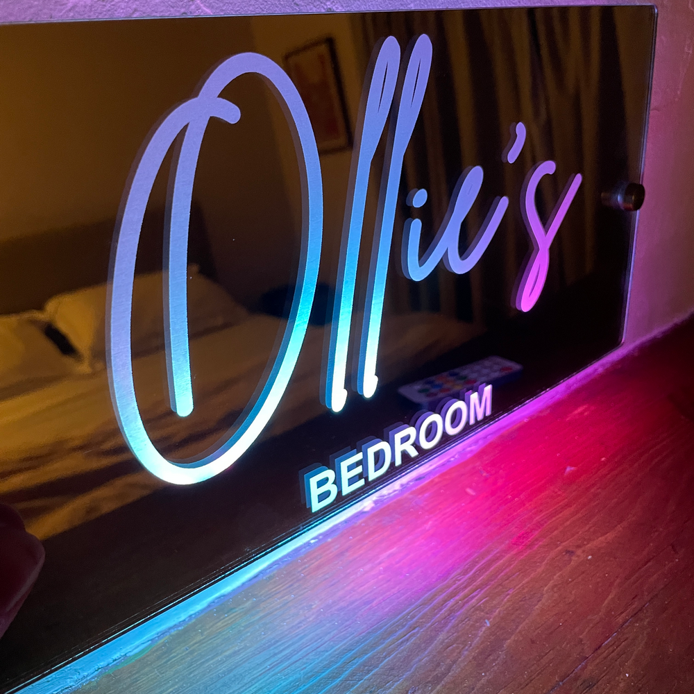 Personalised light-up mirror sign with engraved name, designed for unique home décor with custom LED lighting